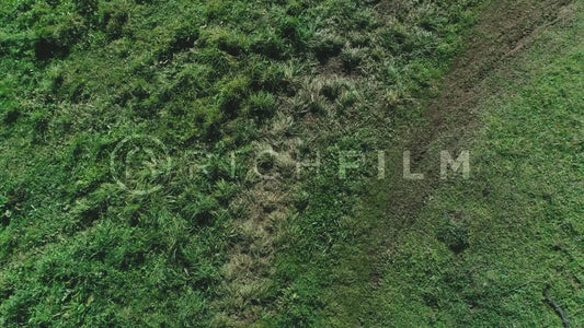 Aerial view of a mountain biker on a dirt track from above