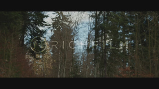 Shot of a mountain biker on a forest path with bushes Winter rides