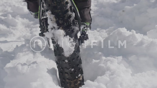 Slow motion shot of a mountain bike tyre as a close-up from behind