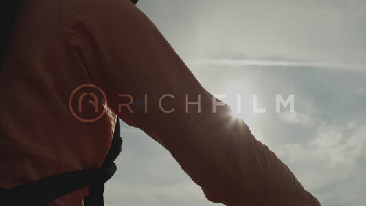 Close-up of a mountain bike arm with the sun behind it