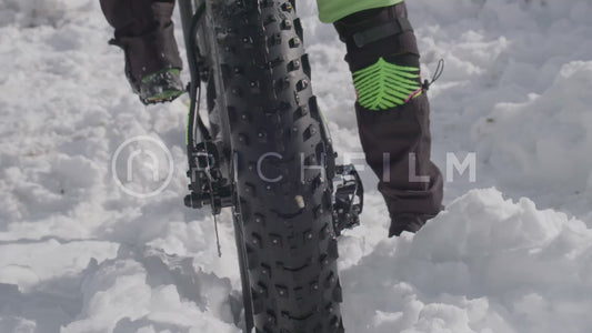 Close-up of a mountain bike tyre in winter